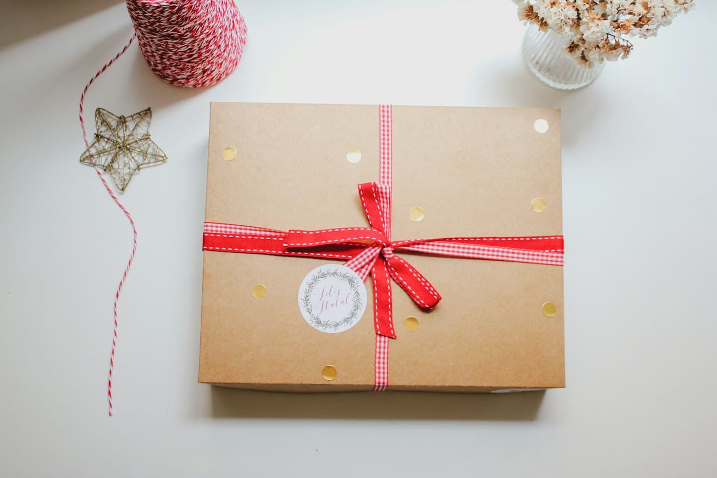 A kraft gift box tied with ribbon